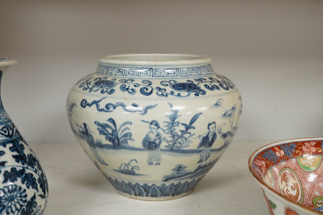 A pair of Chinese blue and white pear shaped vases, a similar jar and a Japanese bowl, largest 23cm in diameter